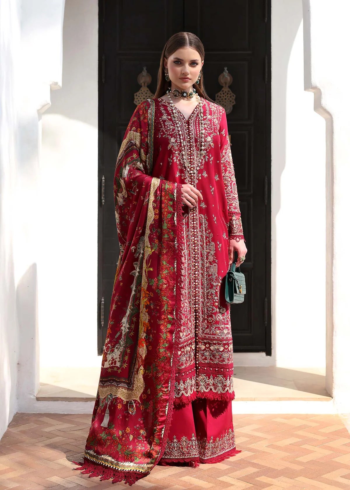 Model wearing deep red Marina outfit from Kanwal Malik Elysia Luxury Lawn '25, perfect for Pakistani luxury pret and clothes online in UK.