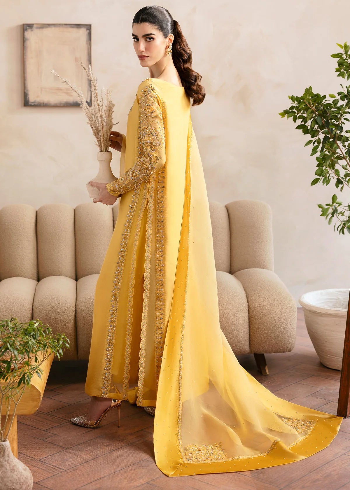 Model wearing Kanwal Malik Saesha yellow luxury pret dress. Shop Pakistani clothes online in the UK for elegant occasion wear.