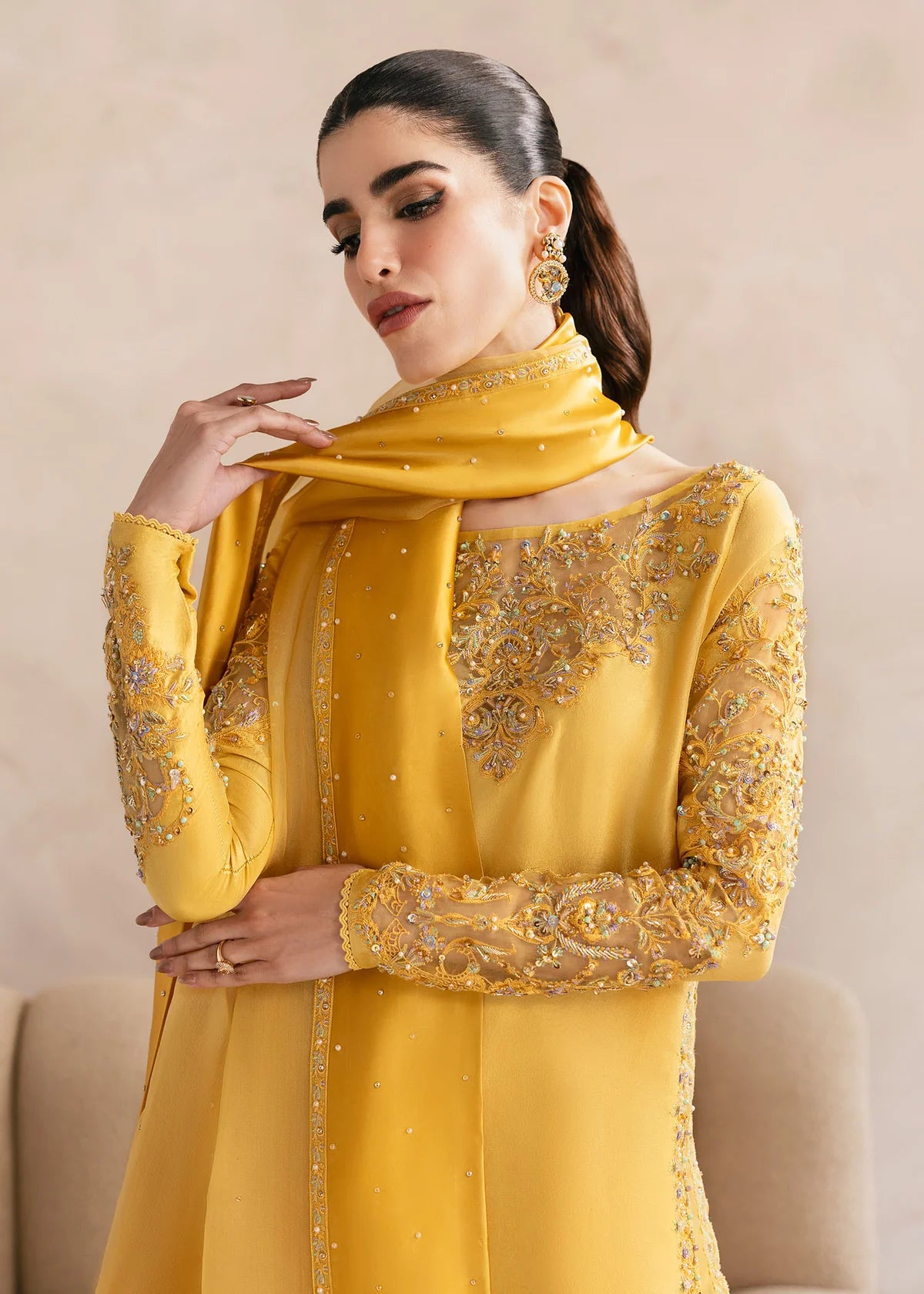 Model wearing Kanwal Malik Saesha yellow luxury pret dress. Shop Pakistani clothes online in the UK for elegant occasion wear.