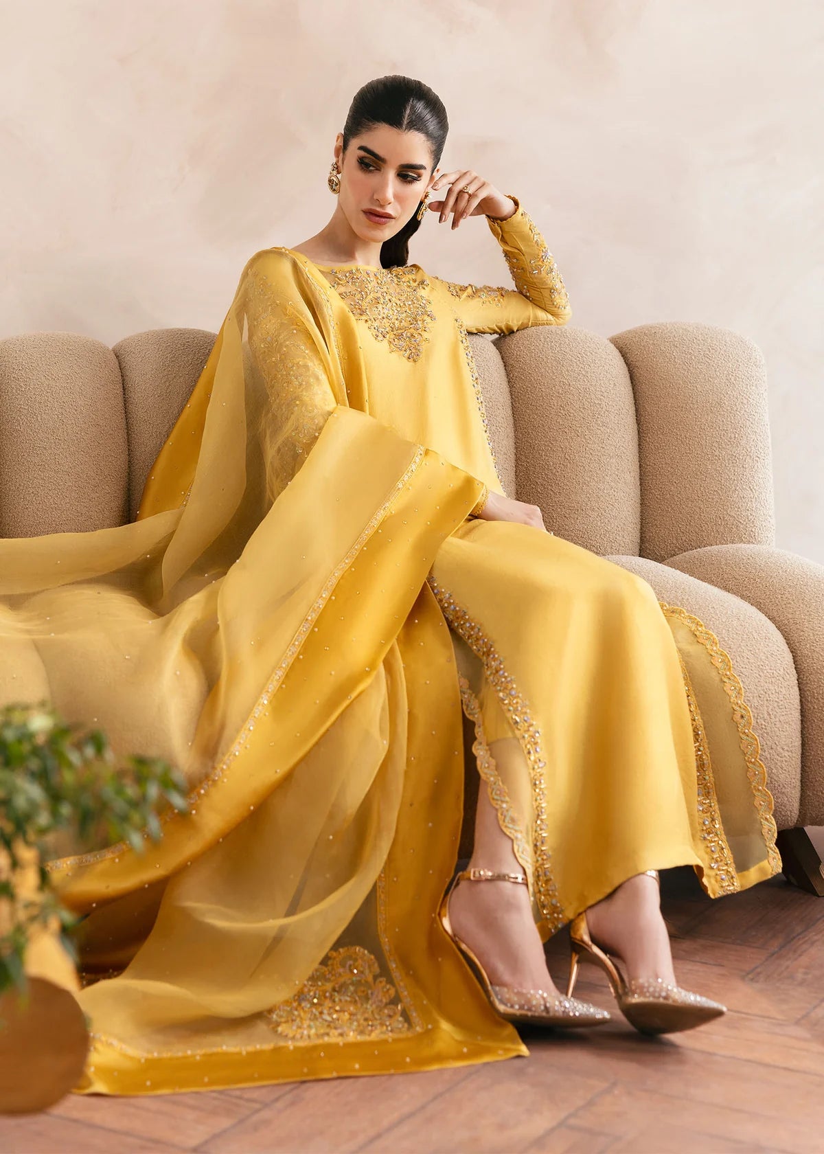 Model wearing Kanwal Malik Saesha yellow luxury pret dress. Shop Pakistani clothes online in the UK for elegant occasion wear.