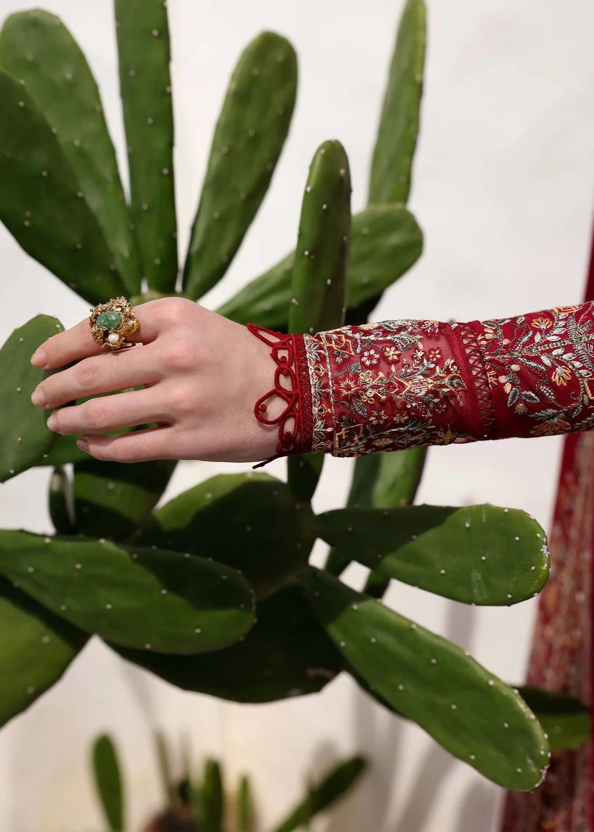 Model wearing deep red Marina outfit from Kanwal Malik Elysia Luxury Lawn '25, perfect for Pakistani luxury pret and clothes online in UK.