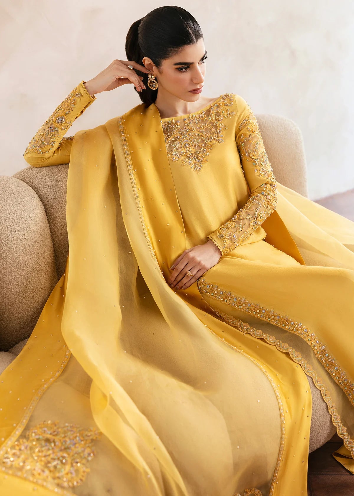 Model wearing Kanwal Malik Saesha yellow luxury pret dress. Shop Pakistani clothes online in the UK for elegant occasion wear.