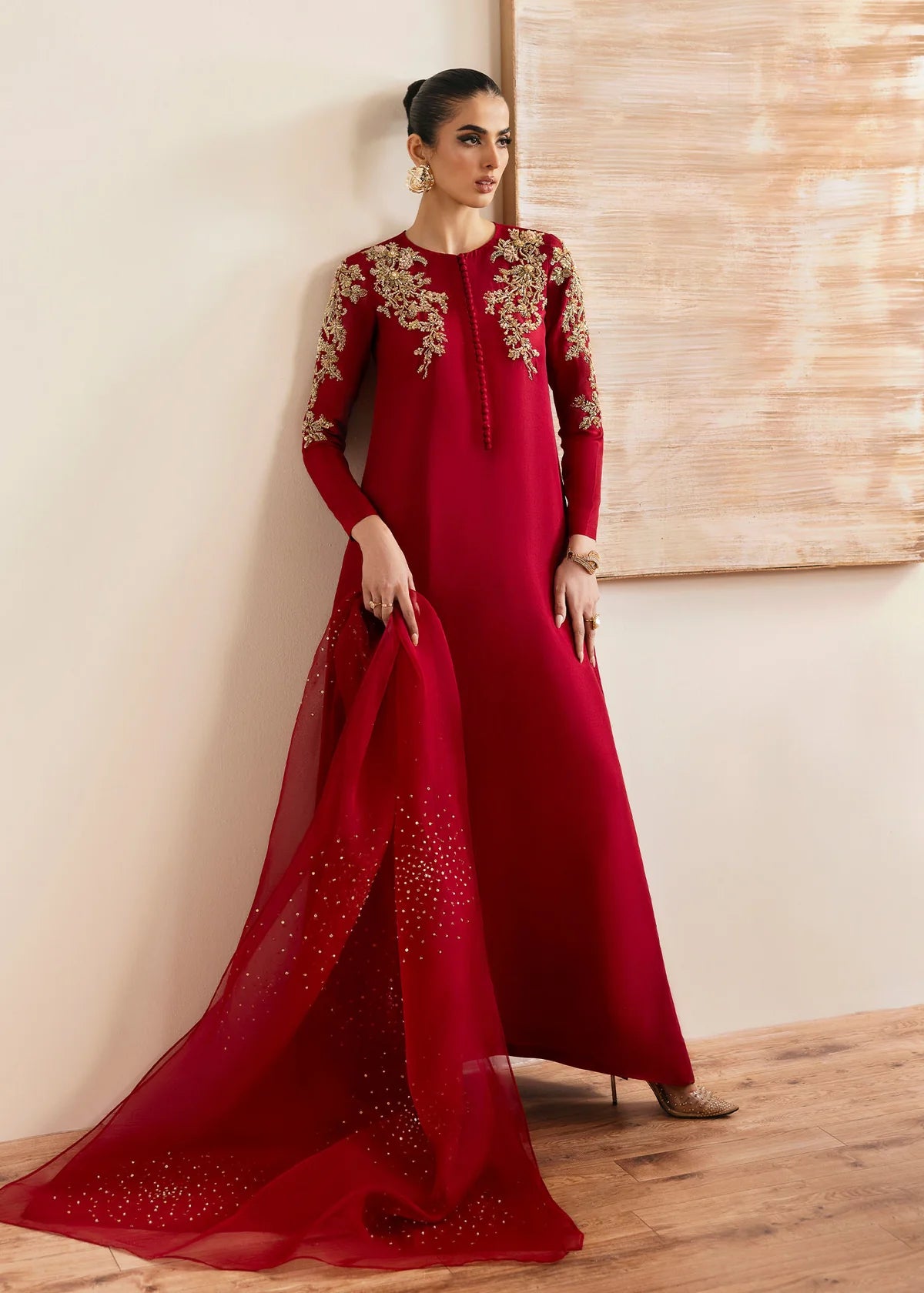 Model wearing Kanwal Malik Rosina deep red embroidered luxury pret dress. Shop Pakistani clothes online in the UK for elegant occasion wear.