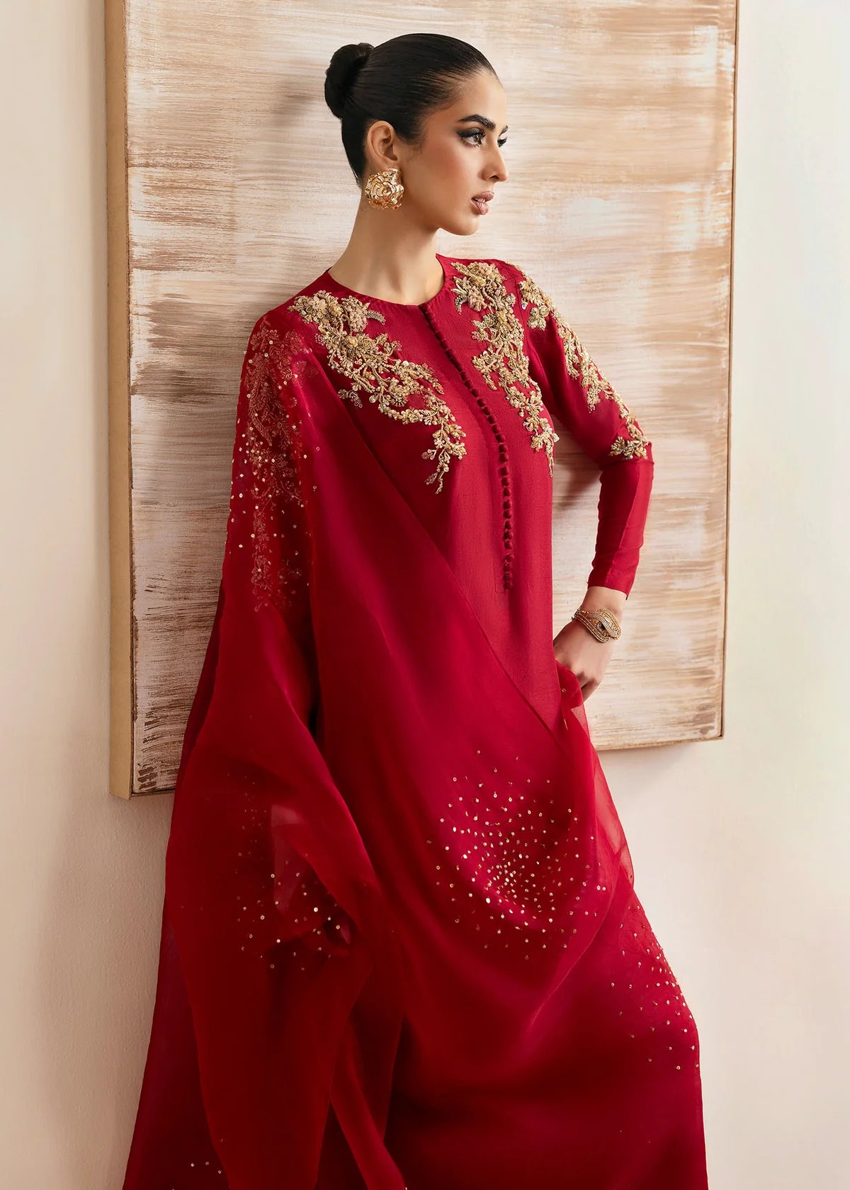 Model wearing Kanwal Malik Rosina deep red embroidered luxury pret dress. Shop Pakistani clothes online in the UK for elegant occasion wear.