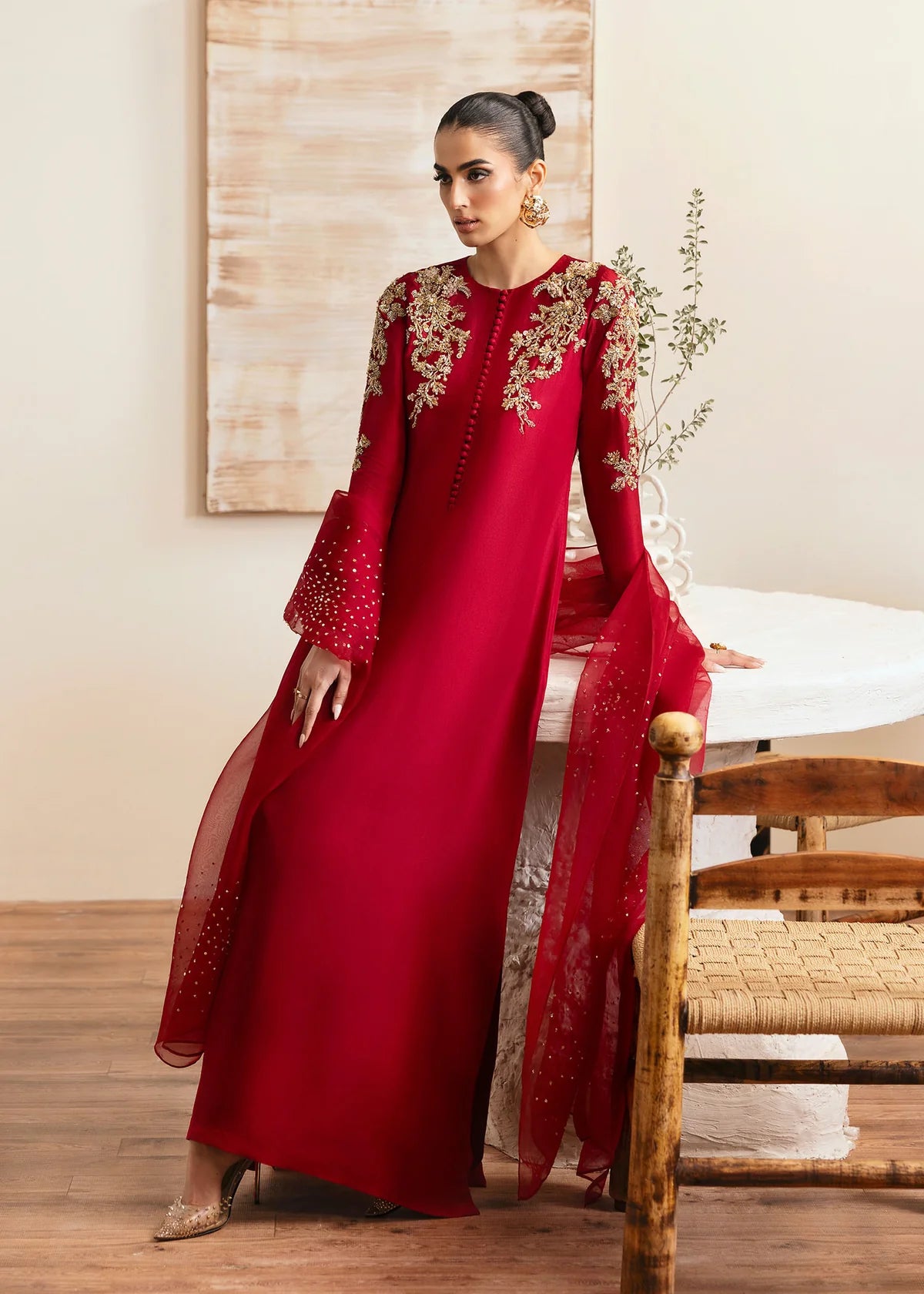 Model wearing Kanwal Malik Rosina deep red embroidered luxury pret dress. Shop Pakistani clothes online in the UK for elegant occasion wear.