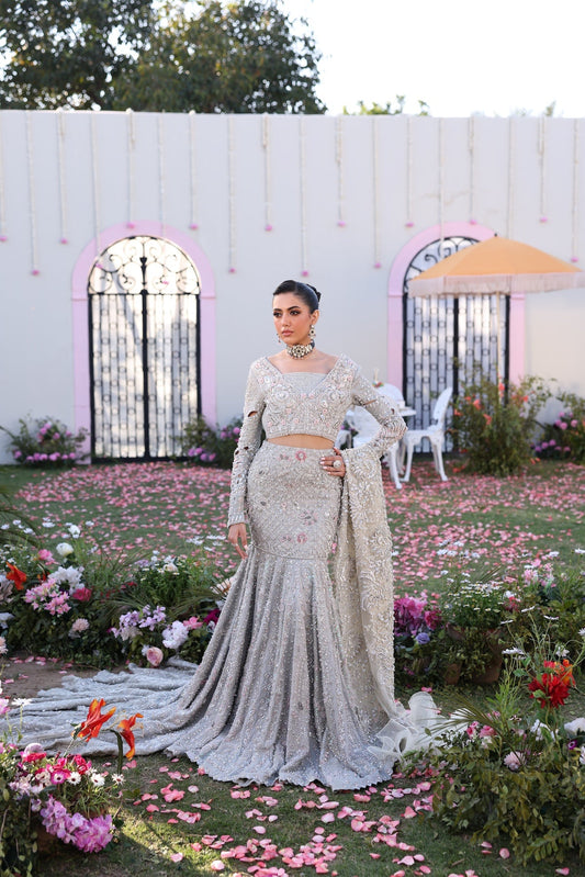 Model wearing silver embellished bridal dress Roshmi from Mysie By Tahira Wedding Edits '25, Pakistani luxury pret online in UK.