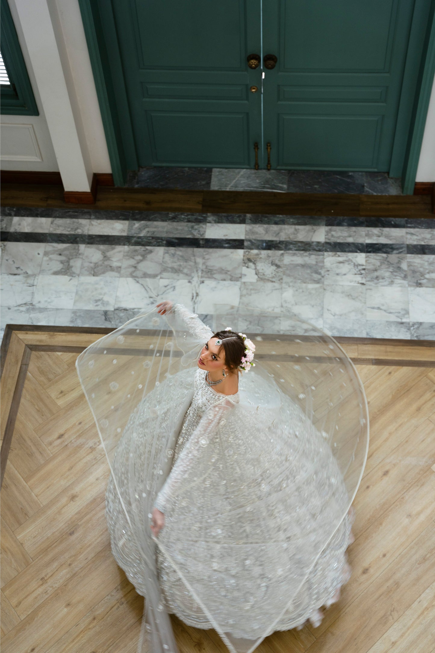 Model wearing silver embellished gown DAHLIA from Mysie by Tahira, Pakistani luxury pret perfect for weddings, now online in UK.