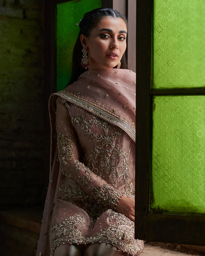 model wearing dusty pink embroidered dress by Faiza Saqlain, Pakistani luxury pret available online in UK