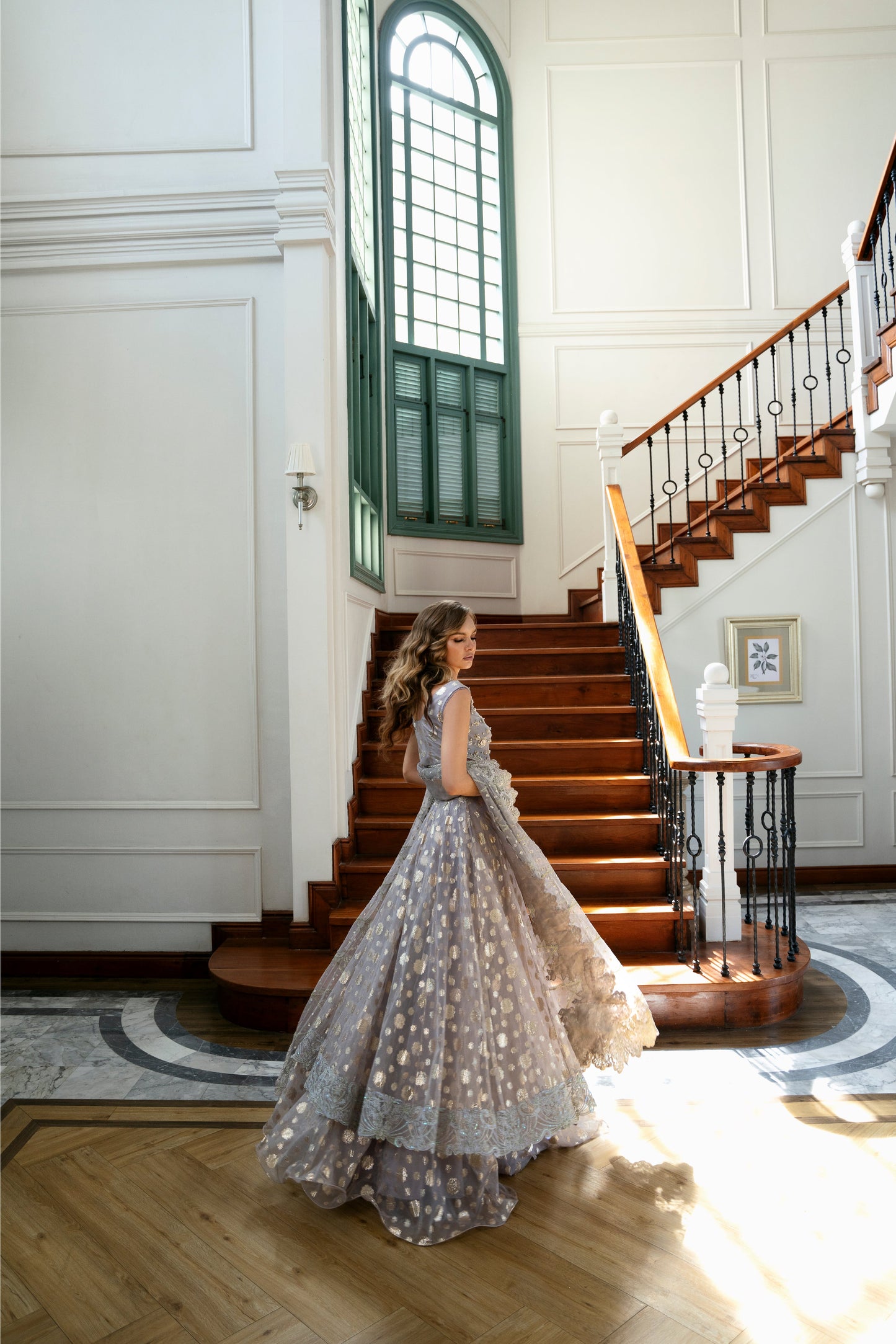 Model wearing Lotus from Mysie by Tahira, a luxurious grey embellished lehenga choli perfect for Pakistani luxury pret in the UK.