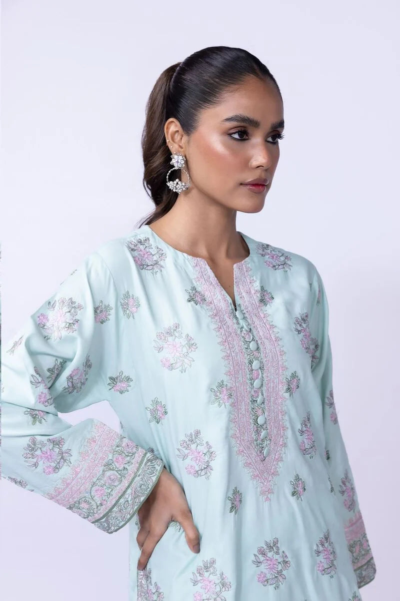 Model wearing Khaadi EST24602B pastel blue dress with delicate floral prints and embroidered details. Shop Pakistani clothes online in the UK now.







