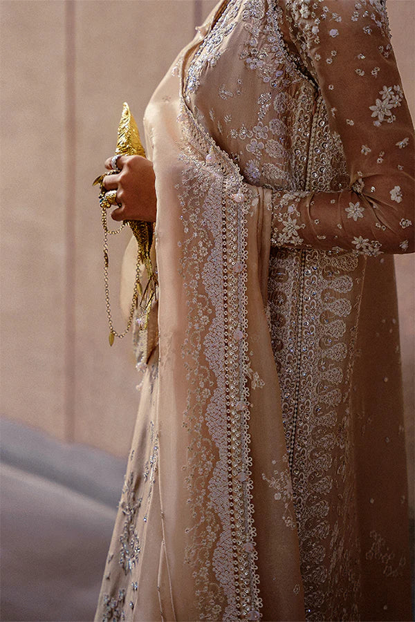 Model wearing beige embellished ensemble from Suffuse Ismira, Pakistani luxury pret, shop Pakistani clothes online in UK
