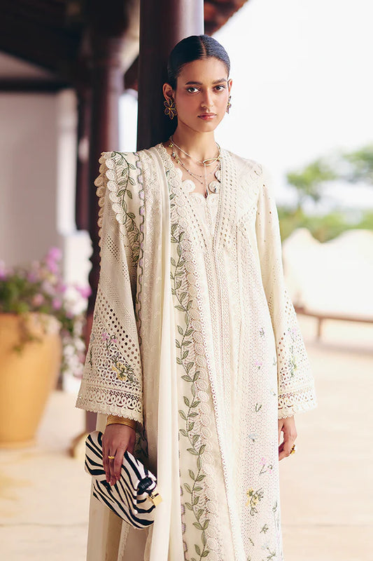 Model wearing off-white embroidered dress with delicate floral accents from Suffuse Casual Pret 2025 Afra. Pakistani luxury pret in UK.