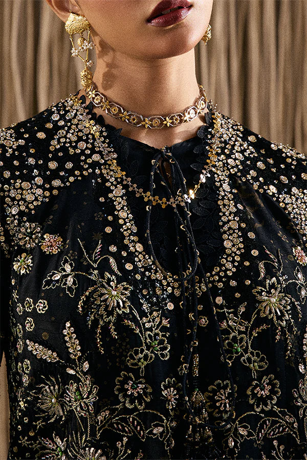 Model wearing black embellished ensemble from Suffuse Kiaray, Pakistani luxury pret, shop Pakistani clothes online in UK
