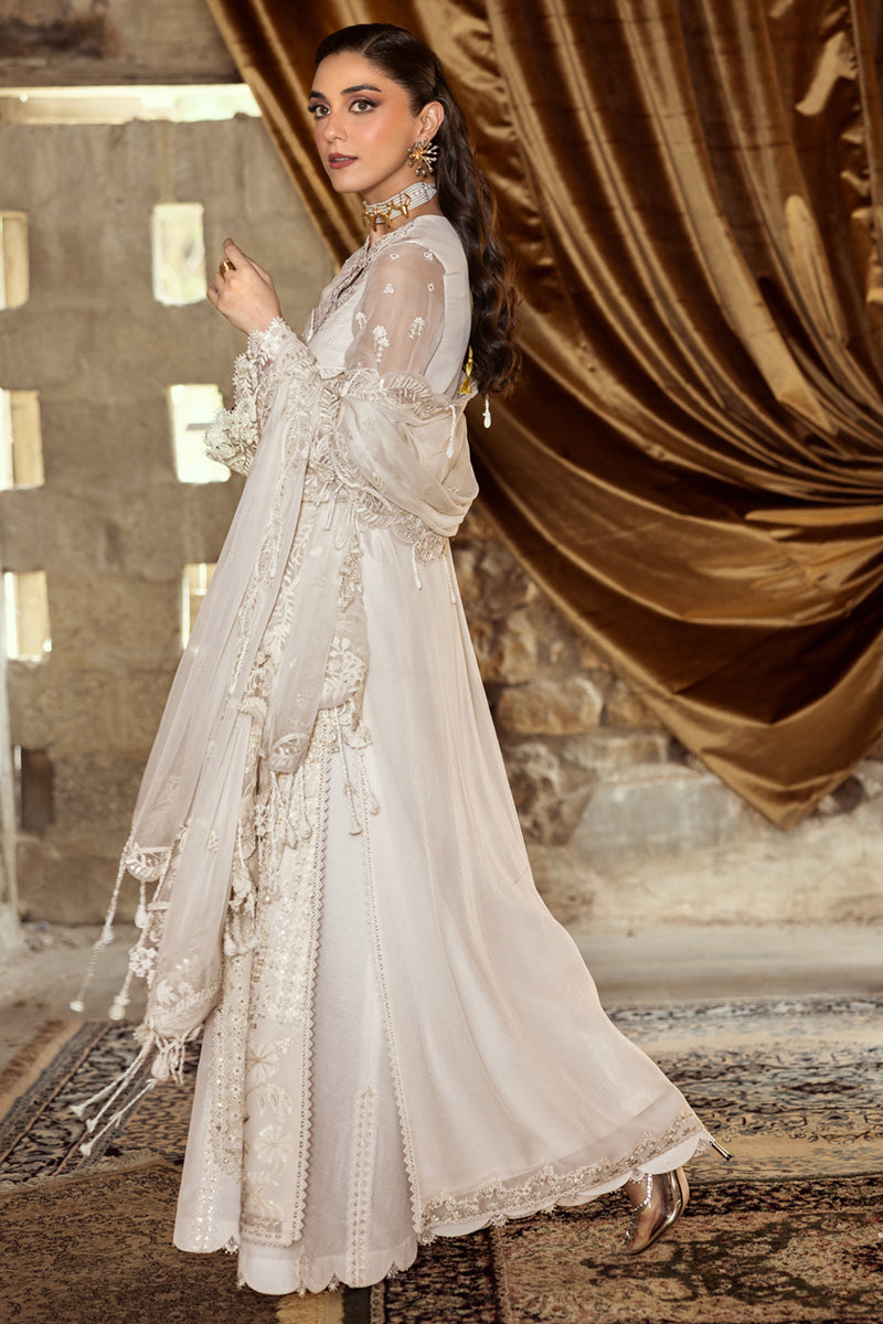 Model wearing ivory embroidered chiffon dress WC-03 ROISE from Qalamkar, perfect for Pakistani luxury pret and Pakistani clothes online in UK.
