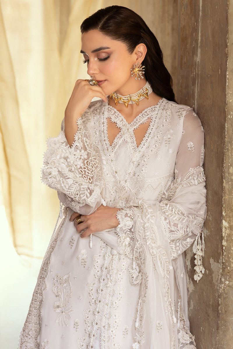 Model wearing ivory embroidered chiffon dress WC-03 ROISE from Qalamkar, perfect for Pakistani luxury pret and Pakistani clothes online in UK.

