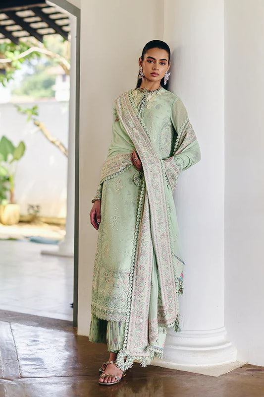 Model wearing pastel mint green embroidered dress from Suffuse Casual Pret 2025 Naire. Pakistani luxury pret and Pakistani clothes online in UK.