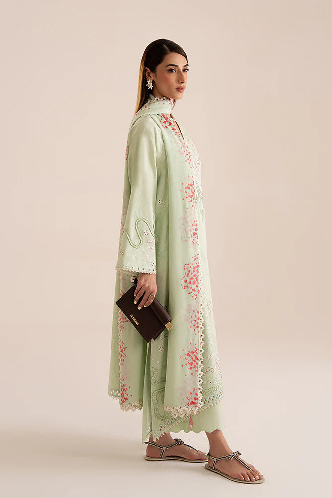 Model wearing Nore by Suffuse in mint green with subtle embroidery and pink accents – a graceful Pakistani luxury pret outfit in UK.