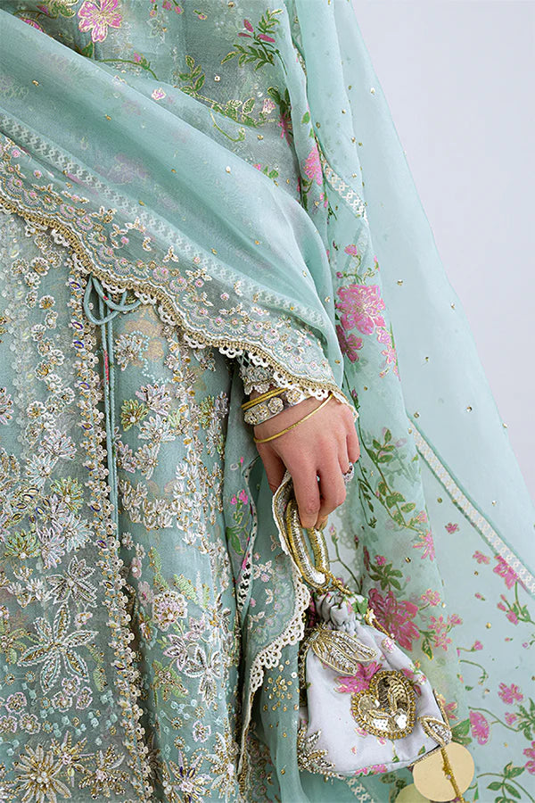 Model wearing aqua blue embellished ensemble from Suffuse Illyra, Pakistani luxury pret, shop Pakistani clothes online in UK
