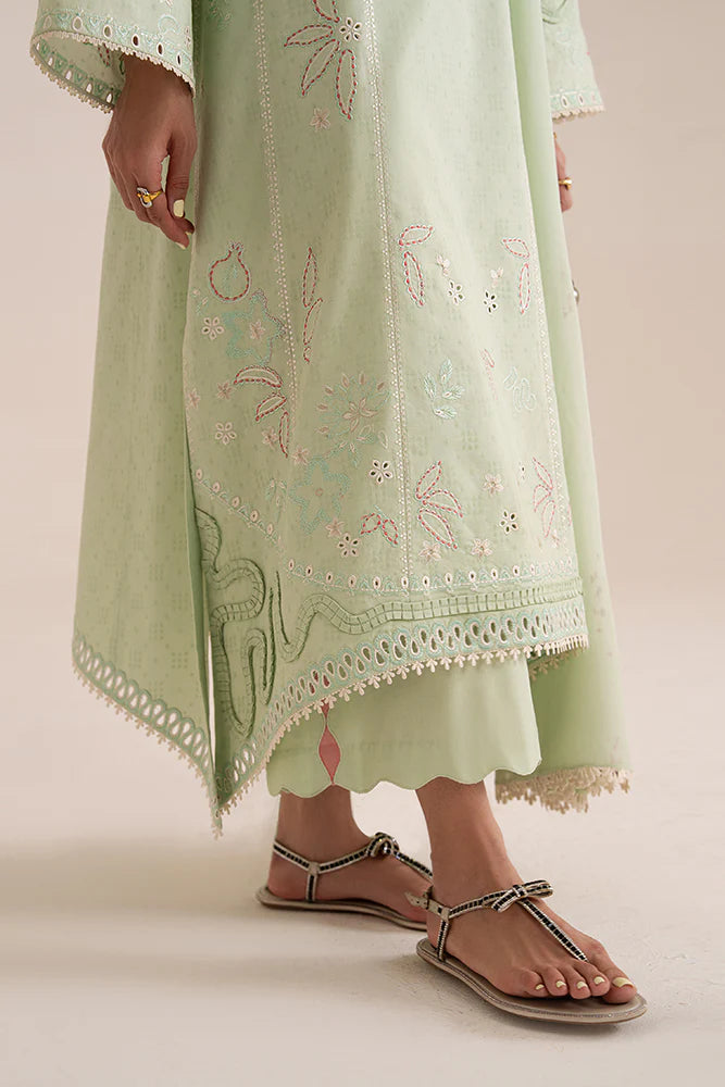 Model wearing Nore by Suffuse in mint green with subtle embroidery and pink accents – a graceful Pakistani luxury pret outfit in UK.