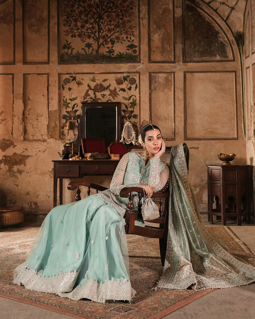 Model wearing mint green Faiza Saqlain Valari outfit with embellished net dupatta and lehenga, perfect for Pakistani luxury pret in UK.