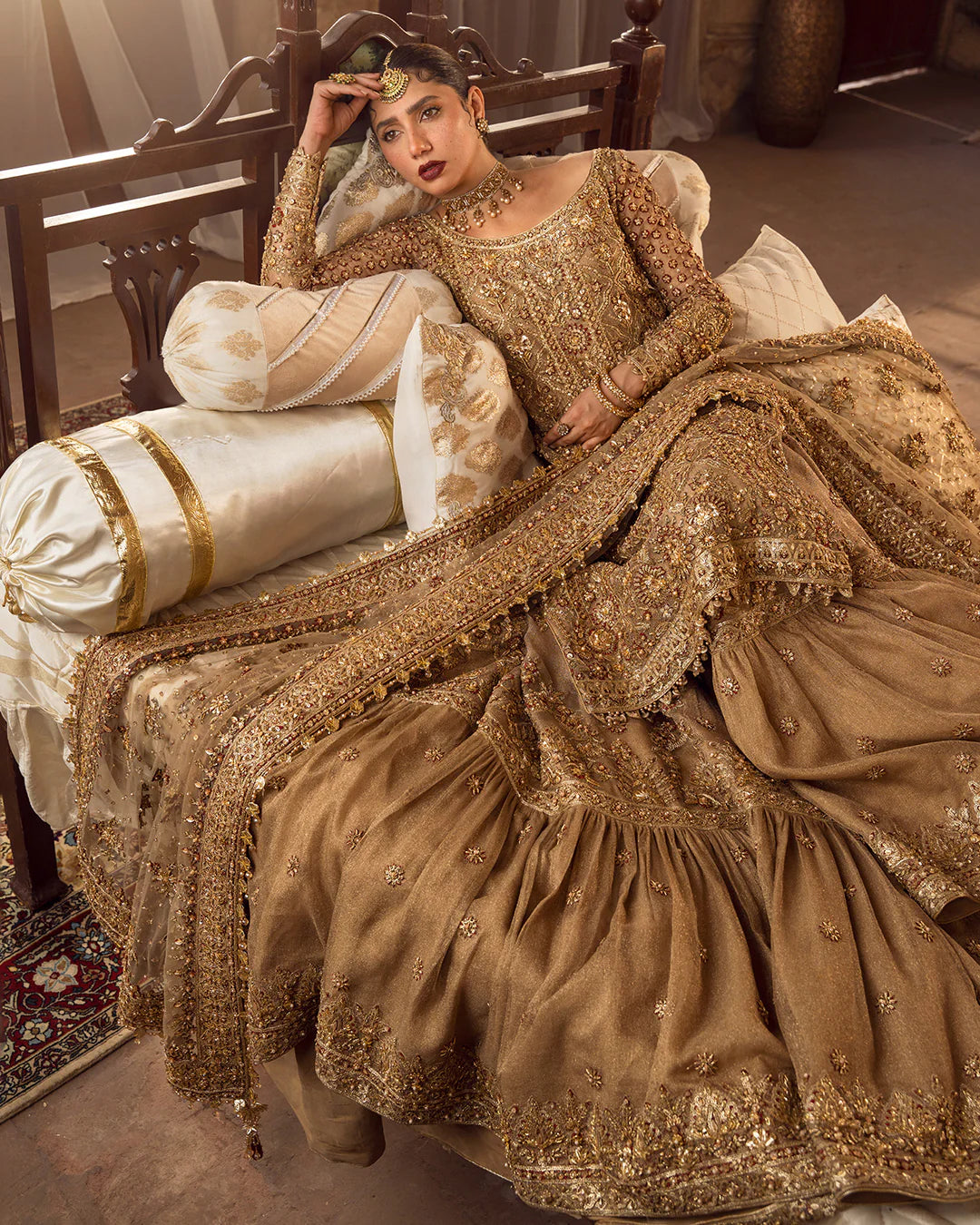 Model wearing golden brown bridal dress Naisha by Faiza Saqlain, Pakistani luxury pret online in UK for weddings.