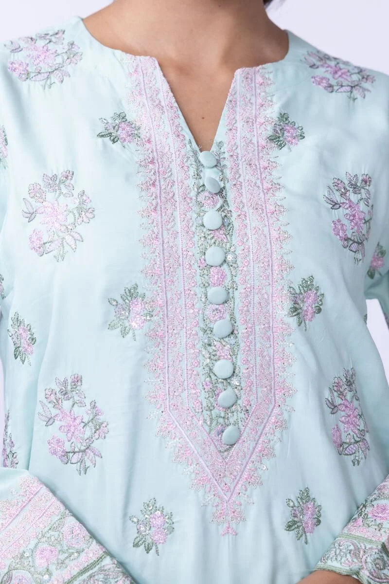 Model wearing Khaadi EST24602B pastel blue dress with delicate floral prints and embroidered details. Shop Pakistani clothes online in the UK now.







