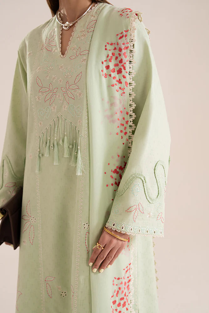 Model wearing Nore by Suffuse in mint green with subtle embroidery and pink accents – a graceful Pakistani luxury pret outfit in UK.