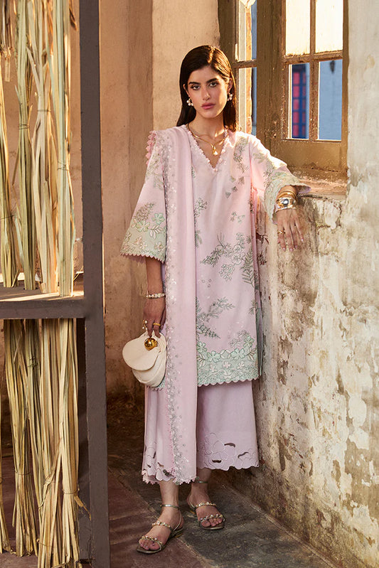 Model wearing Sarin by Suffuse in pastel pink with green embroidery – feminine Pakistani luxury pret outfit in UK.