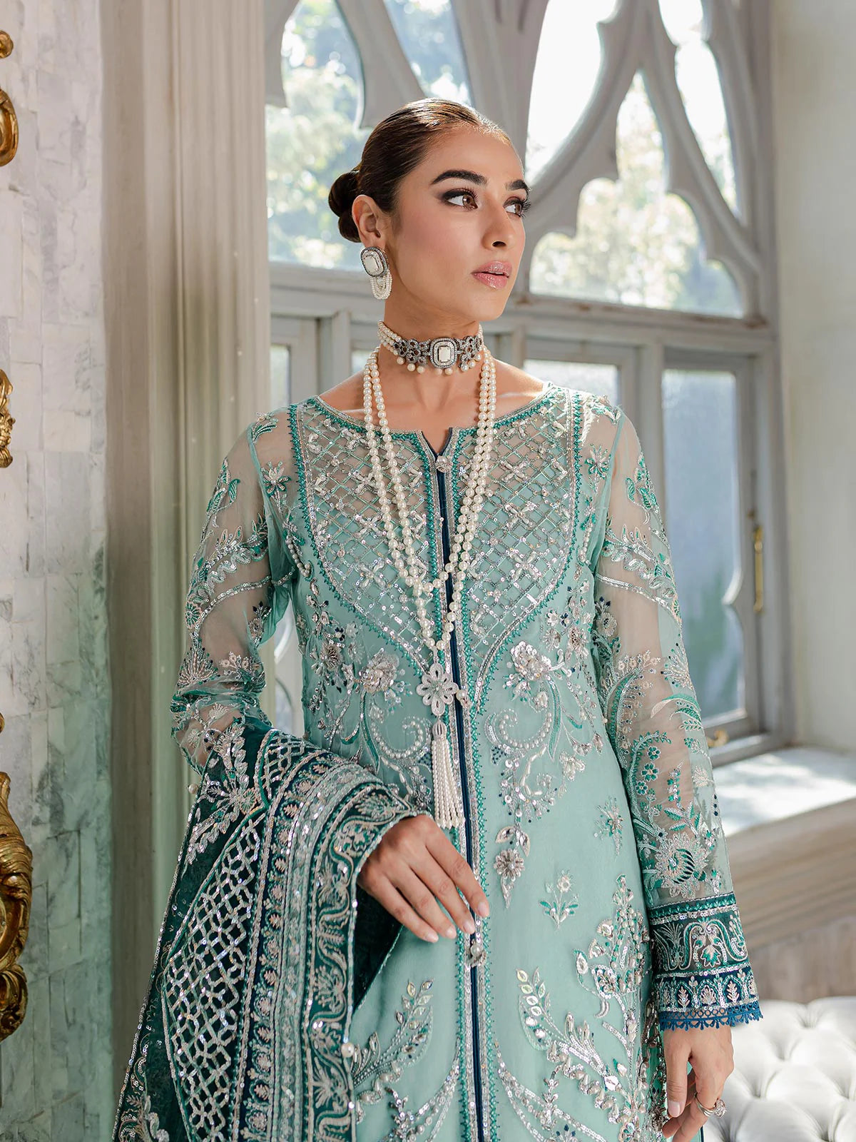 Model wearing sea green Milica outfit from Gulaal—Pakistani luxury pret with intricate embroidery, shop Pakistani clothes online in UK.