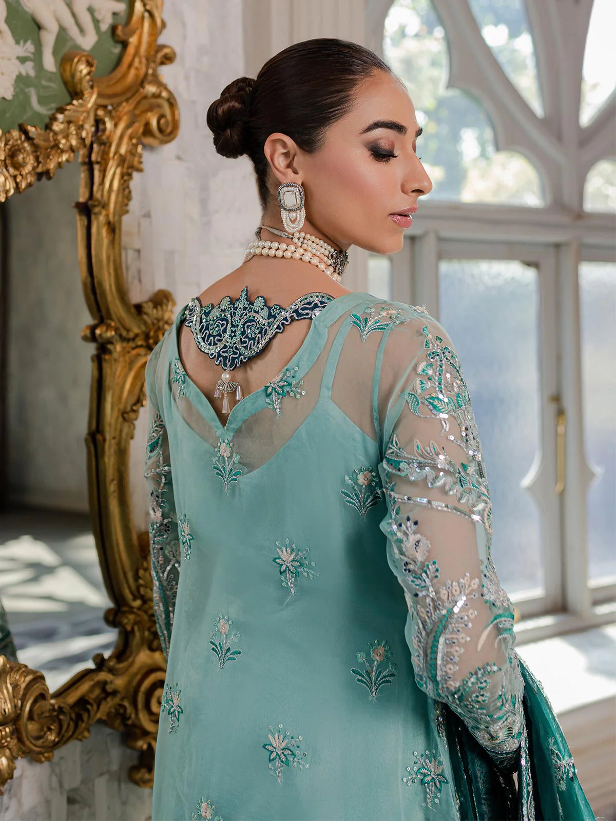 Model wearing sea green Milica outfit from Gulaal—Pakistani luxury pret with intricate embroidery, shop Pakistani clothes online in UK.