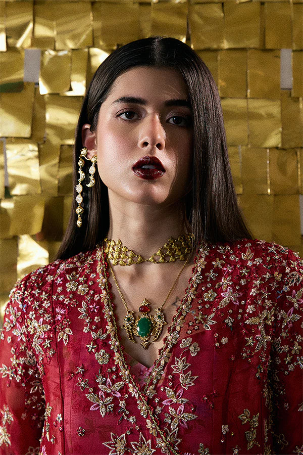Model wearing wine red embellished ensemble from Suffuse Jaseria, Pakistani luxury pret, shop Pakistani clothes online in UK
