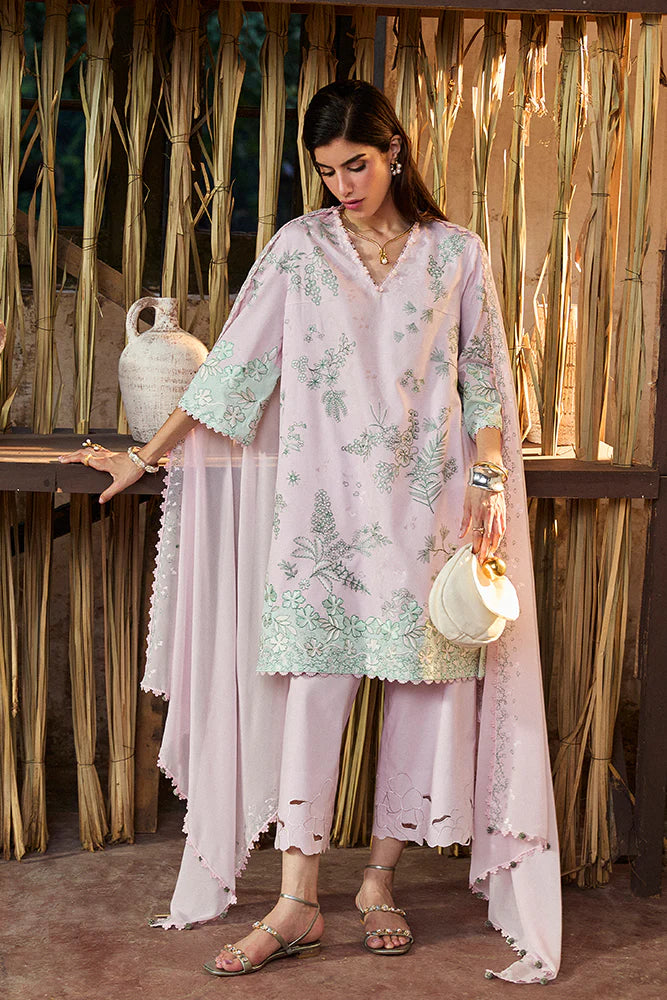 Model wearing Sarin by Suffuse in pastel pink with green embroidery – feminine Pakistani luxury pret outfit in UK.