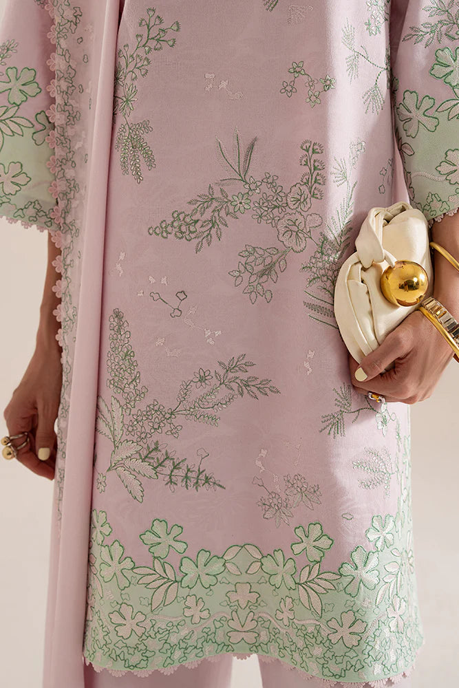 Model wearing Sarin by Suffuse in pastel pink with green embroidery – feminine Pakistani luxury pret outfit in UK.