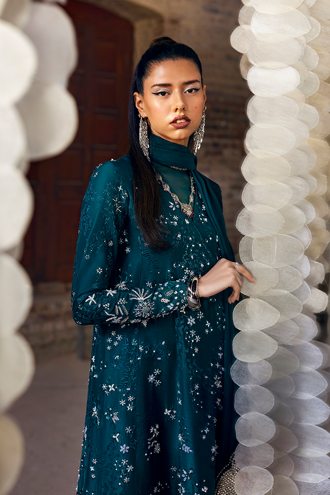 Model wearing SOLARA, side angle, a Pakistani designer outfit by Suffuse, available online in the UK.