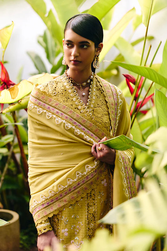Model wearing mustard yellow embroidered dress from Suffuse Casual Pret 2025 Zorah. Pakistani luxury pret and Pakistani clothes online in UK.
