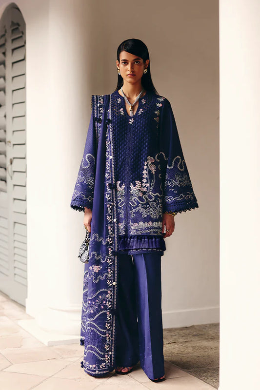 Model wearing deep navy blue embroidered dress with intricate detailing from Suffuse Casual Pret 2025 Sahra. Pakistani luxury pret in UK.
