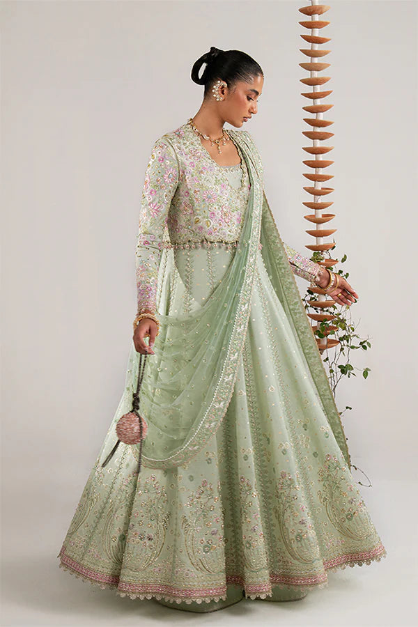 Model wearing pastel green embellished ensemble from Suffuse Aymara, Pakistani luxury pret, shop Pakistani clothes online in UK
