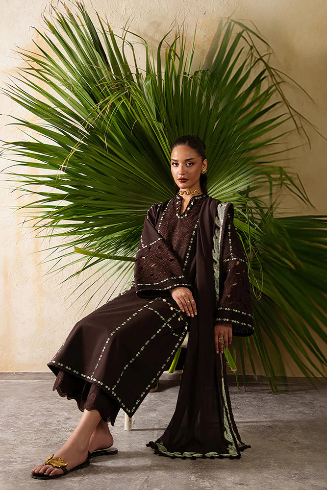 Model wearing Ruva by Suffuse in deep chocolate brown with embroidered details – chic Pakistani luxury pret outfit in UK.