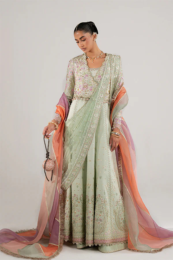 Model wearing pastel green embellished ensemble from Suffuse Aymara, Pakistani luxury pret, shop Pakistani clothes online in UK
