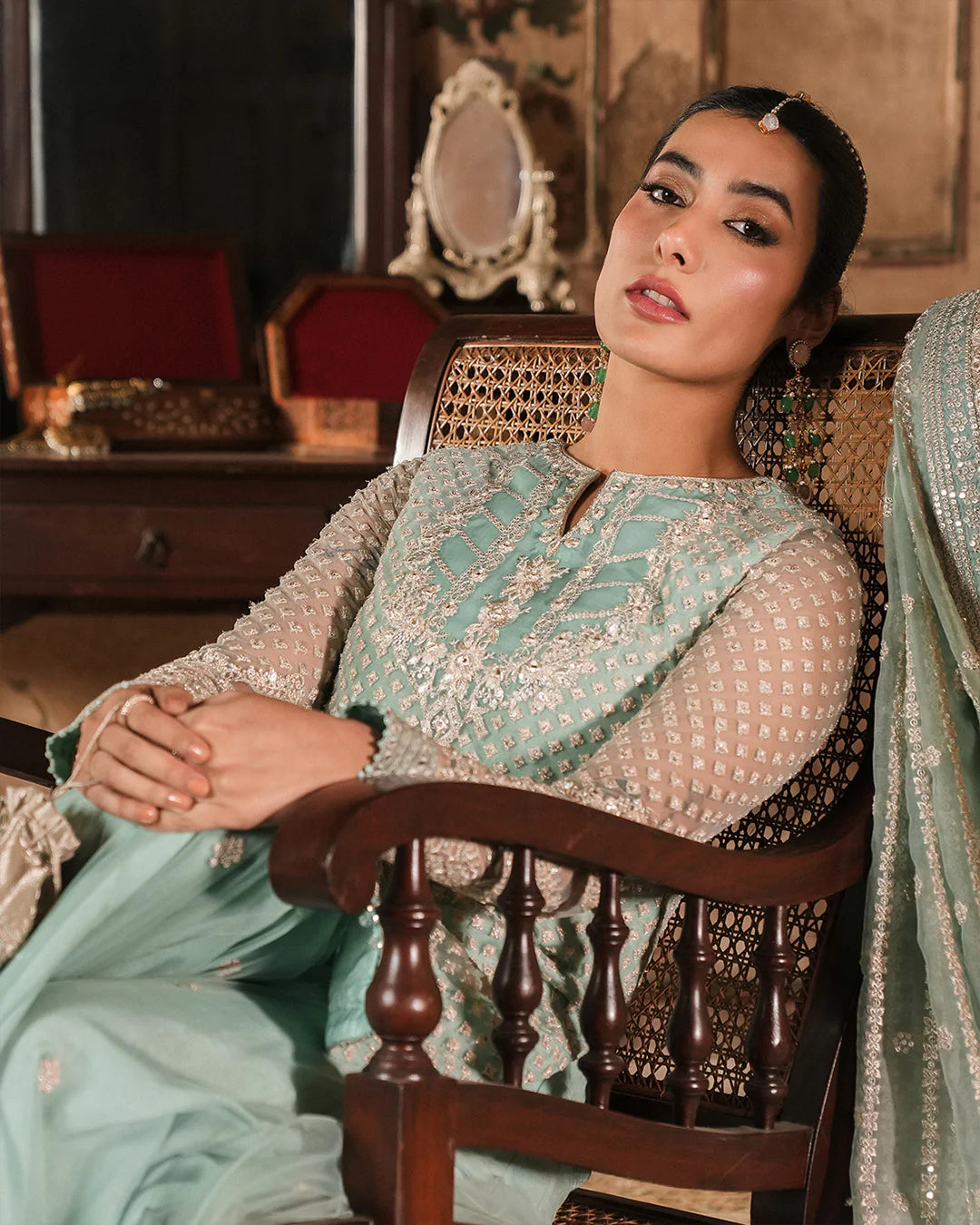 Model wearing mint green Faiza Saqlain Valari outfit with embellished net dupatta and lehenga, perfect for Pakistani luxury pret in UK.