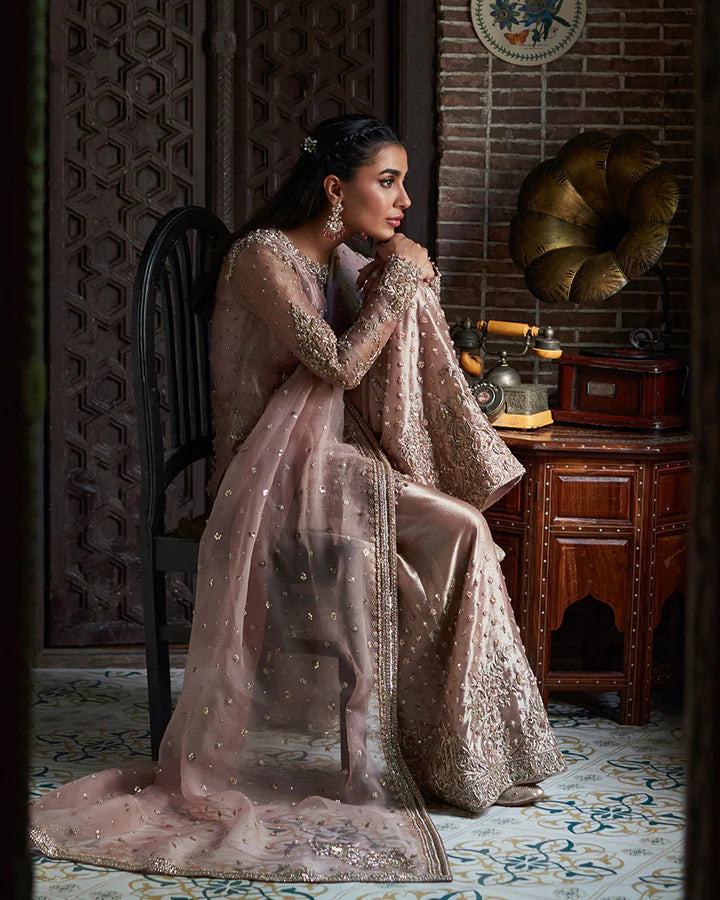 model wearing dusty pink embroidered dress by Faiza Saqlain, Pakistani luxury pret available online in UK
