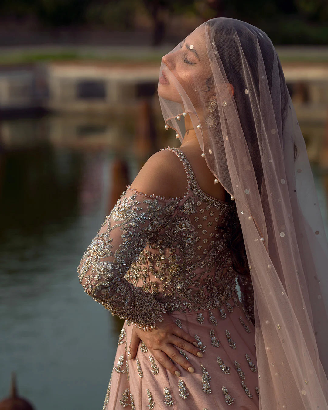 Model wearing dusty pink Aysana dress by Faiza Saqlain, Pakistani luxury pret online in UK for weddings and festive wear.