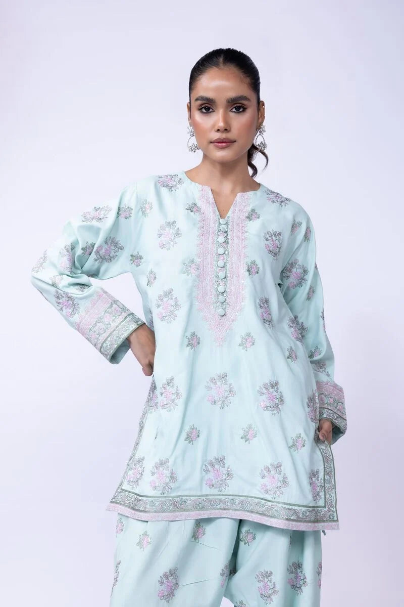 Model wearing Khaadi EST24602B pastel blue dress with delicate floral prints and embroidered details. Shop Pakistani clothes online in the UK now.







