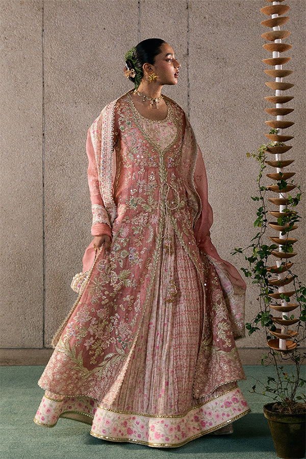 Model wearing rose coral embellished ensemble from Suffuse Novara, Pakistani luxury pret, shop Pakistani clothes online in UK
