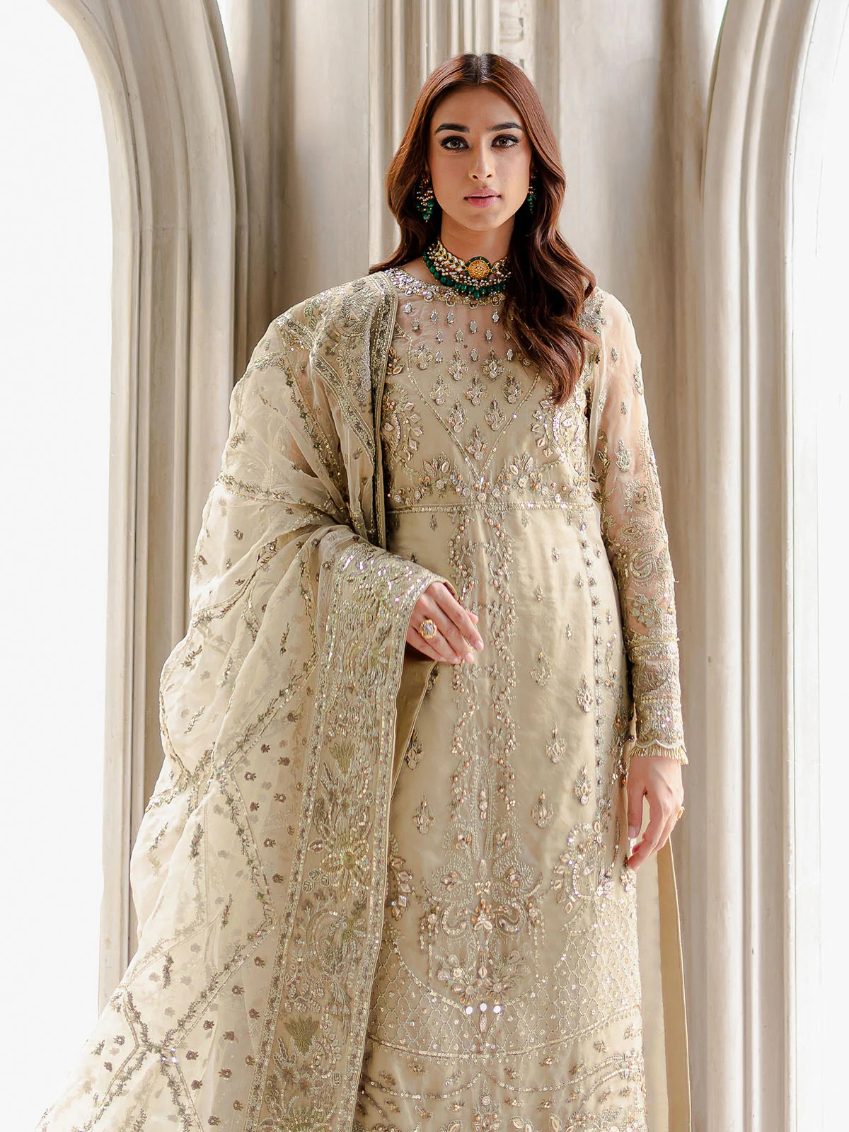 Model wearing beige Warina GL-LP-V1-05 from Gulaal, a heavily embellished Pakistani luxury pret—shop Gulaal clothes online in UK.