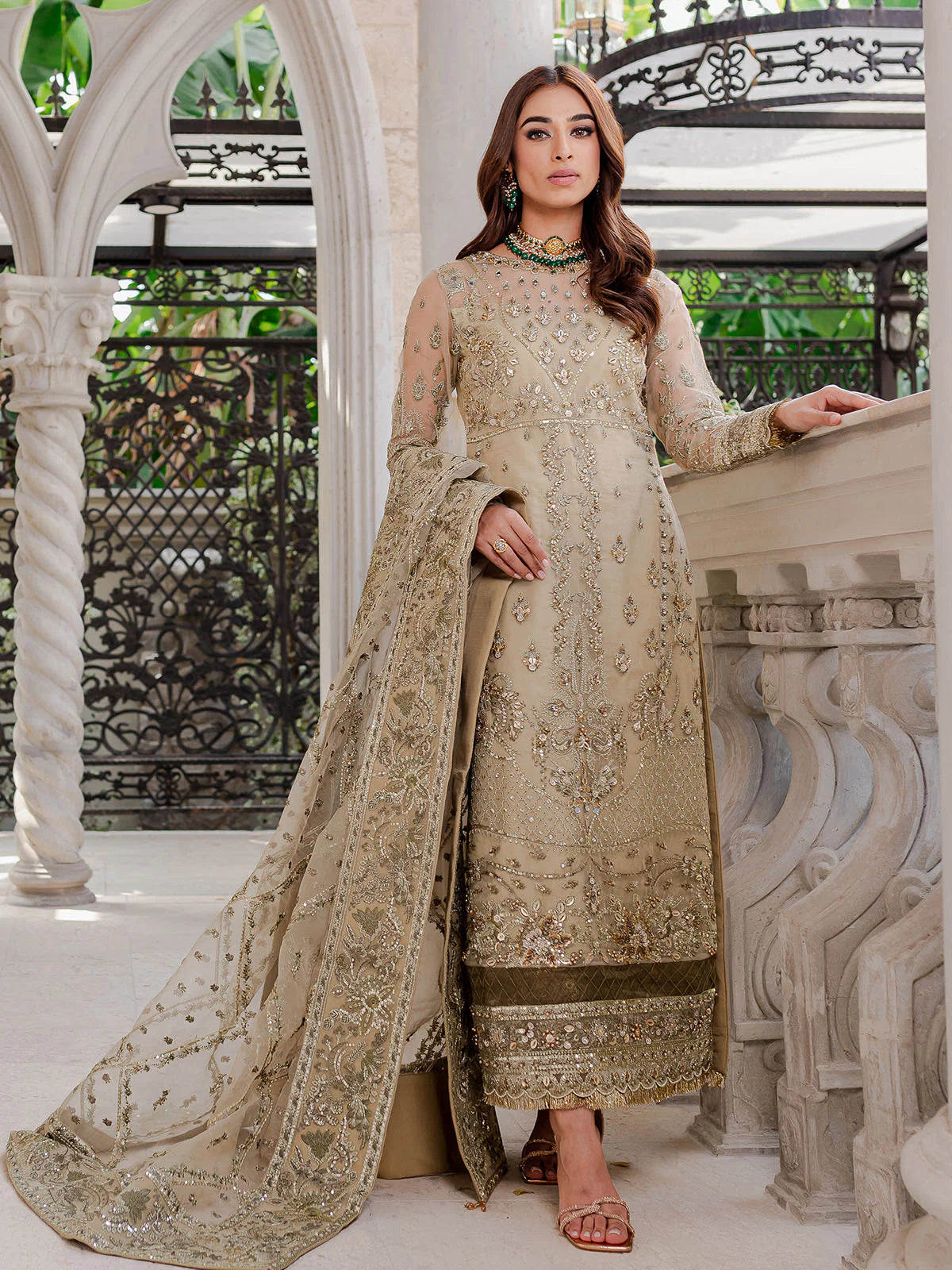 Model wearing beige Warina GL-LP-V1-05 from Gulaal, a heavily embellished Pakistani luxury pret—shop Gulaal clothes online in UK.
