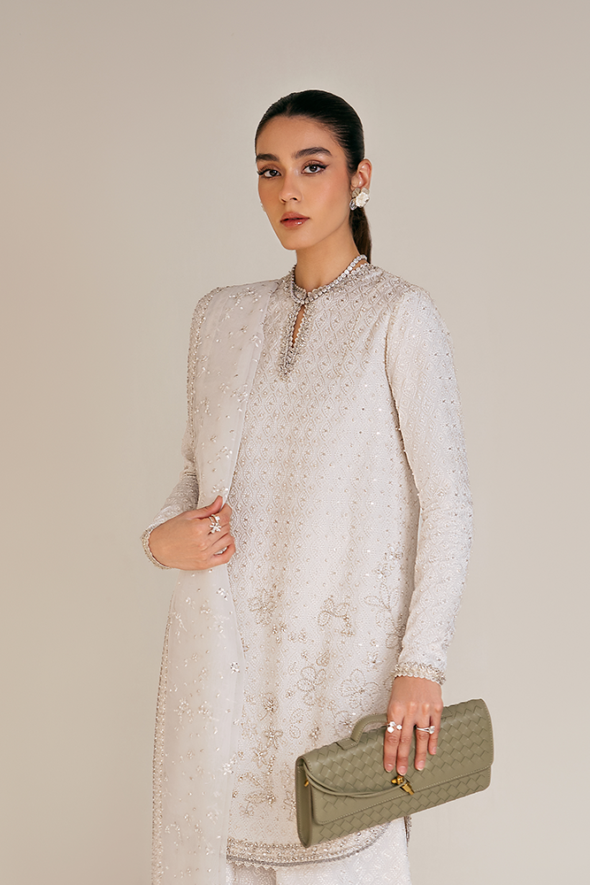 Model wearing ELUNA, sleeves close-up, a Pakistani designer outfit by Suffuse, available online in the UK.