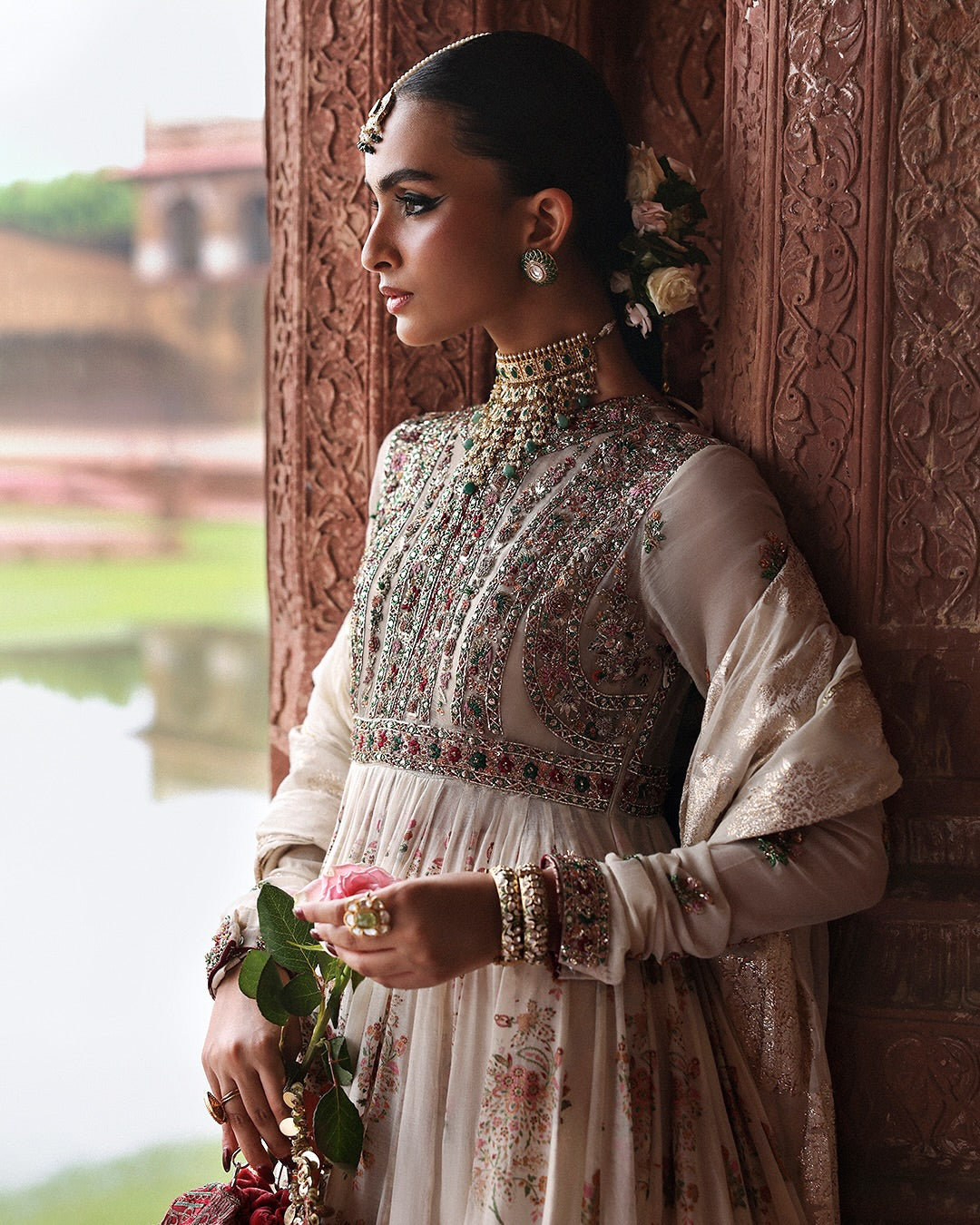 Model wearing Zayrah by Hussain Rehar in ivory and gold with intricate embroidery – regal Pakistani luxury pret outfit in UK.