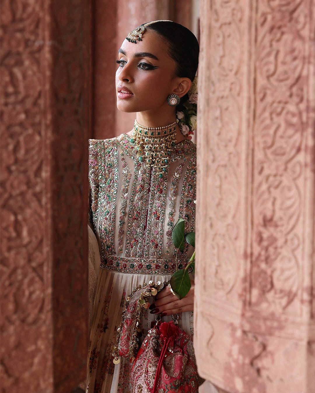 Model wearing Zayrah by Hussain Rehar in ivory and gold with intricate embroidery – regal Pakistani luxury pret outfit in UK.