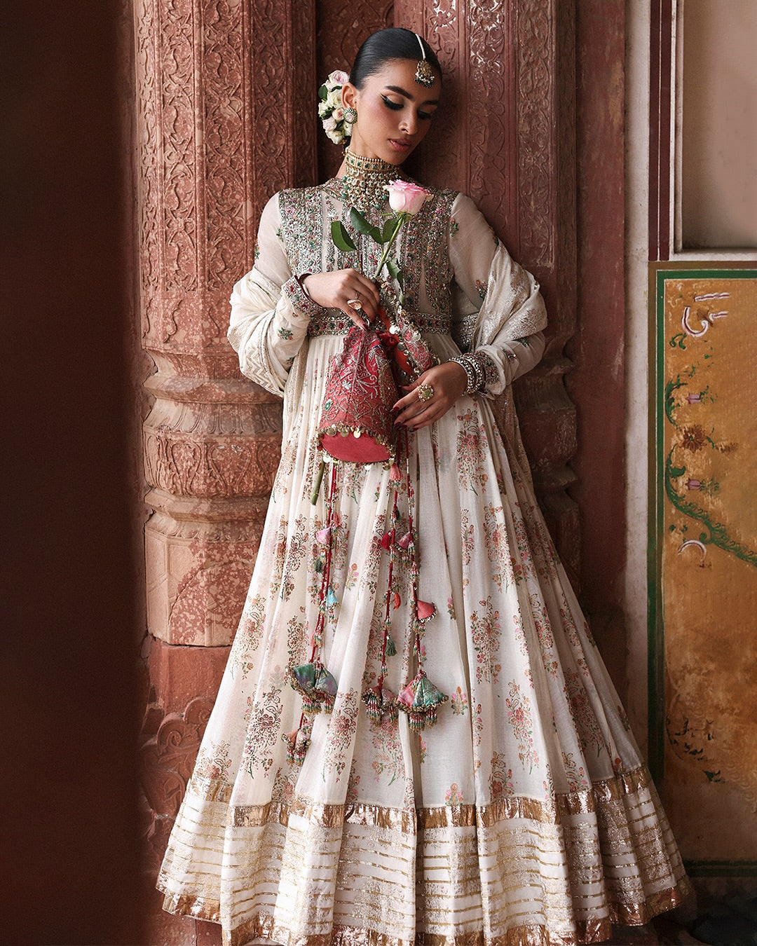 Model wearing Zayrah by Hussain Rehar in ivory and gold with intricate embroidery – regal Pakistani luxury pret outfit in UK.
